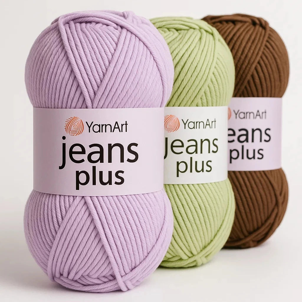 Three balls of YarnArt Jeans Plus yarn in purple, green, and brown on a white background